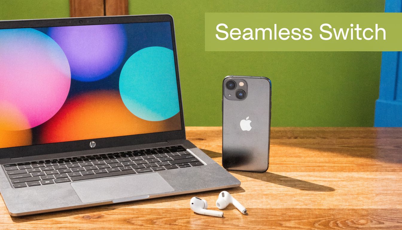 An HP laptop, an iPhone, and wireless earbuds resting on a wooden desk with a green background.