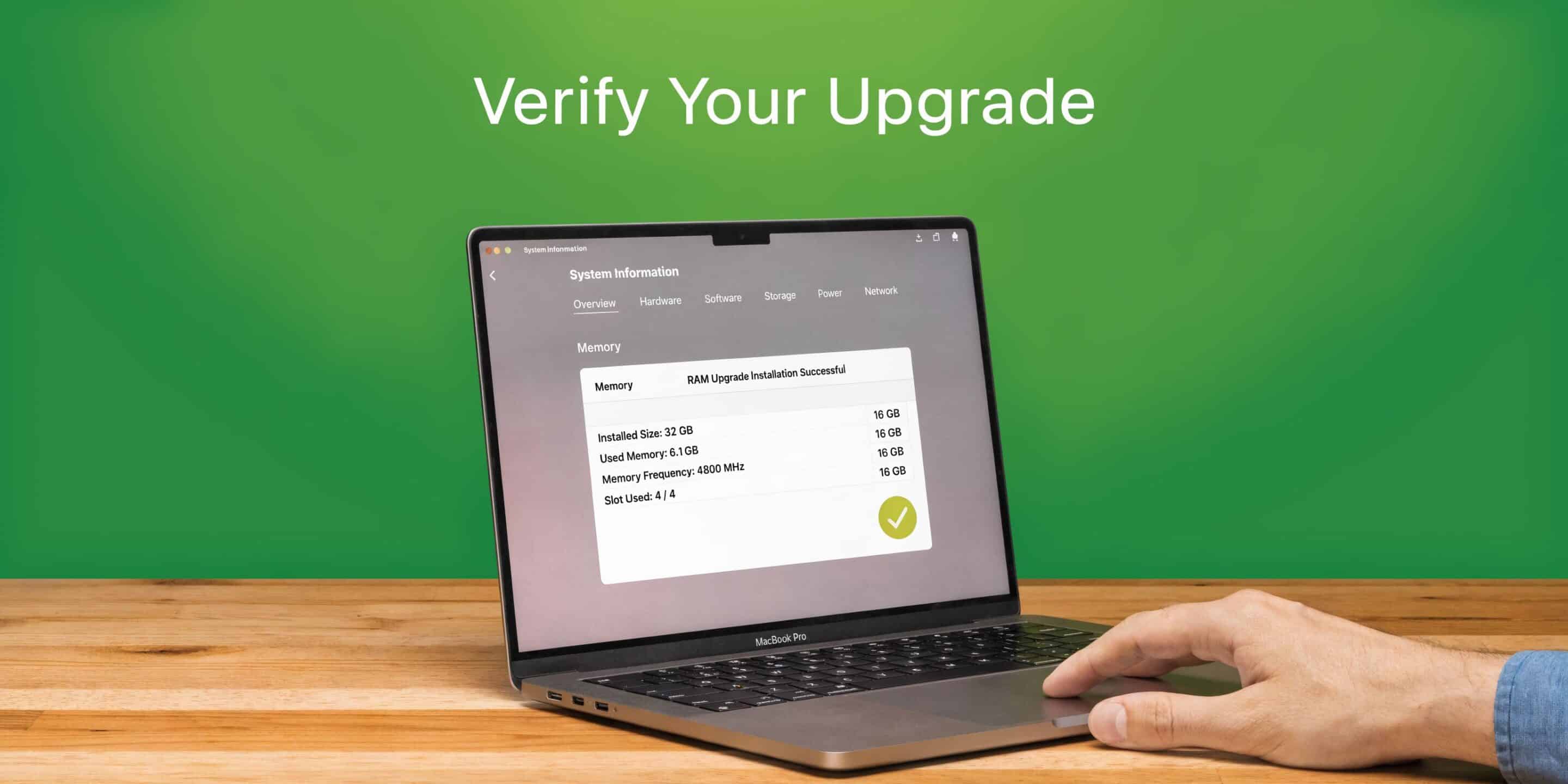 A hand using a laptop to verify a successful RAM upgrade in the system information settings menu.