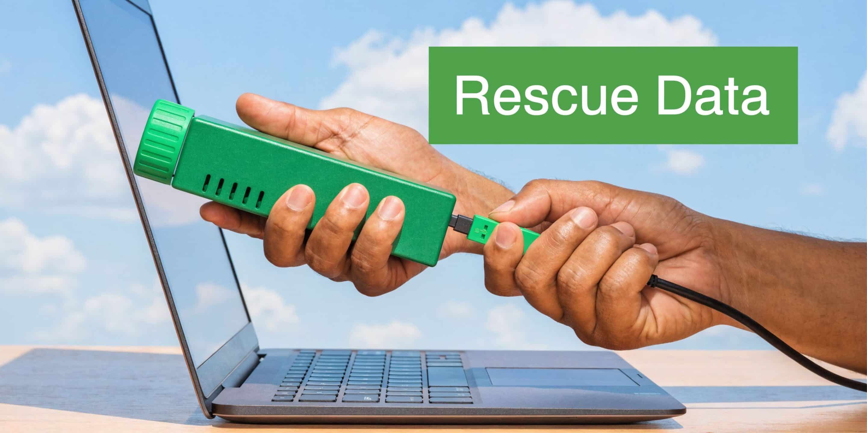 A hand connecting a green data recovery device to a laptop screen to rescue important digital files.