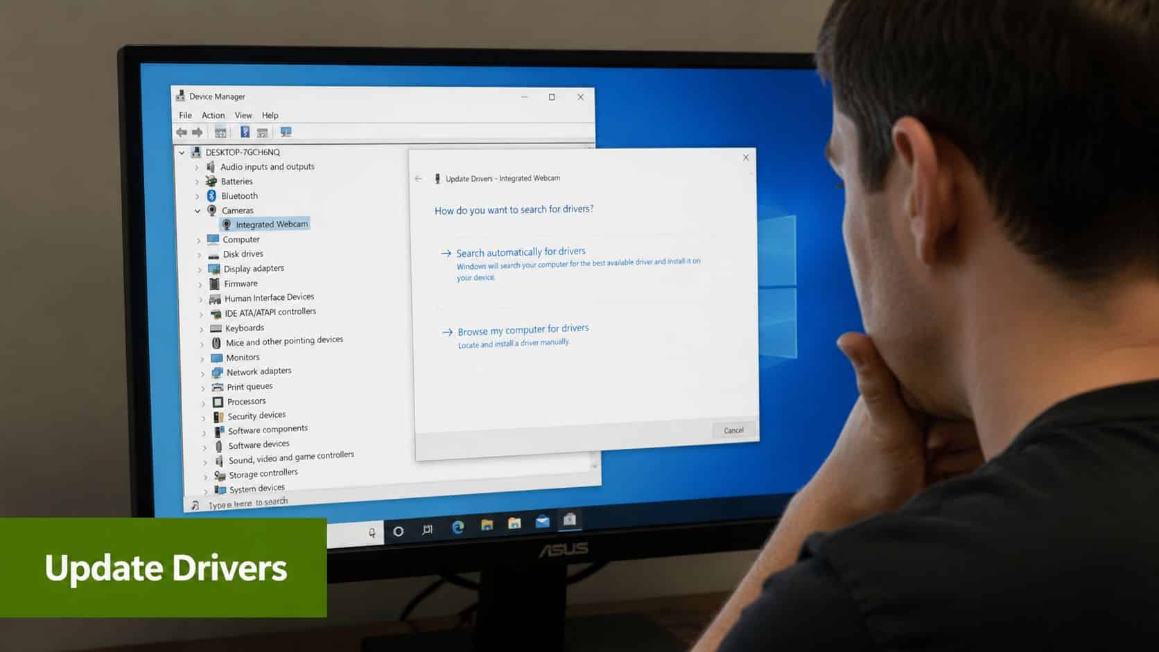 A person looking at a computer screen showing the Windows Device Manager updating drivers for an integrated webcam.
