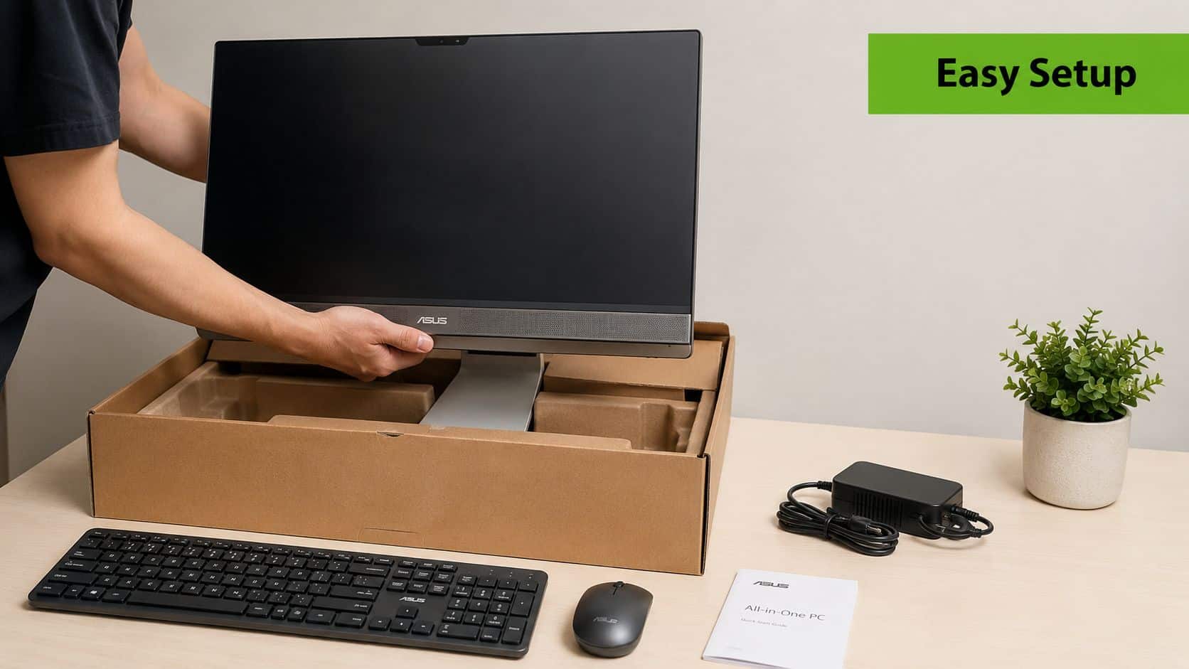 A person unboxing an ASUS All-in-One PC with a keyboard, mouse, and power adapter on a desk.
