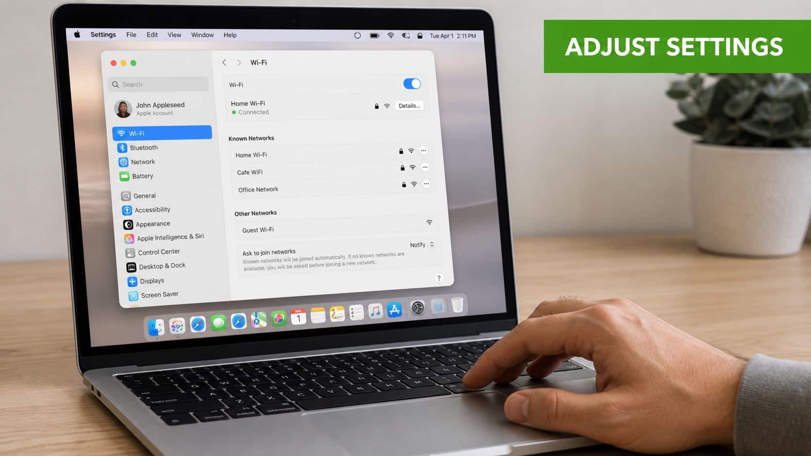 A close-up of a person using a MacBook to access Wi-Fi settings on their laptop screen.